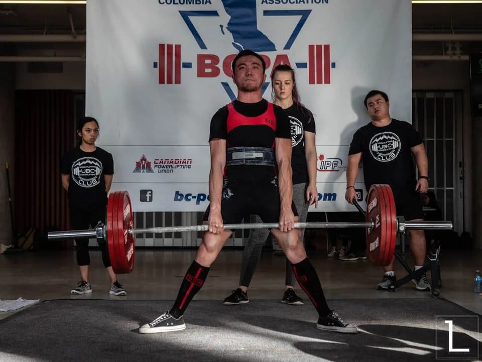 Eric setting up a deadlift at a powerlifting meet